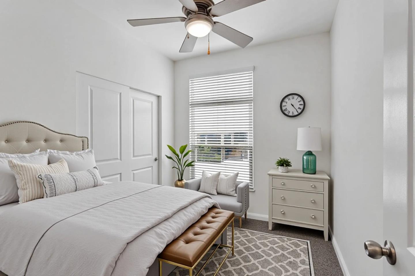 356 Reservation Road, Unit 68 Marina, CA 93933 - Photo 19 of 32 a bedroom with a bed and a chandelier