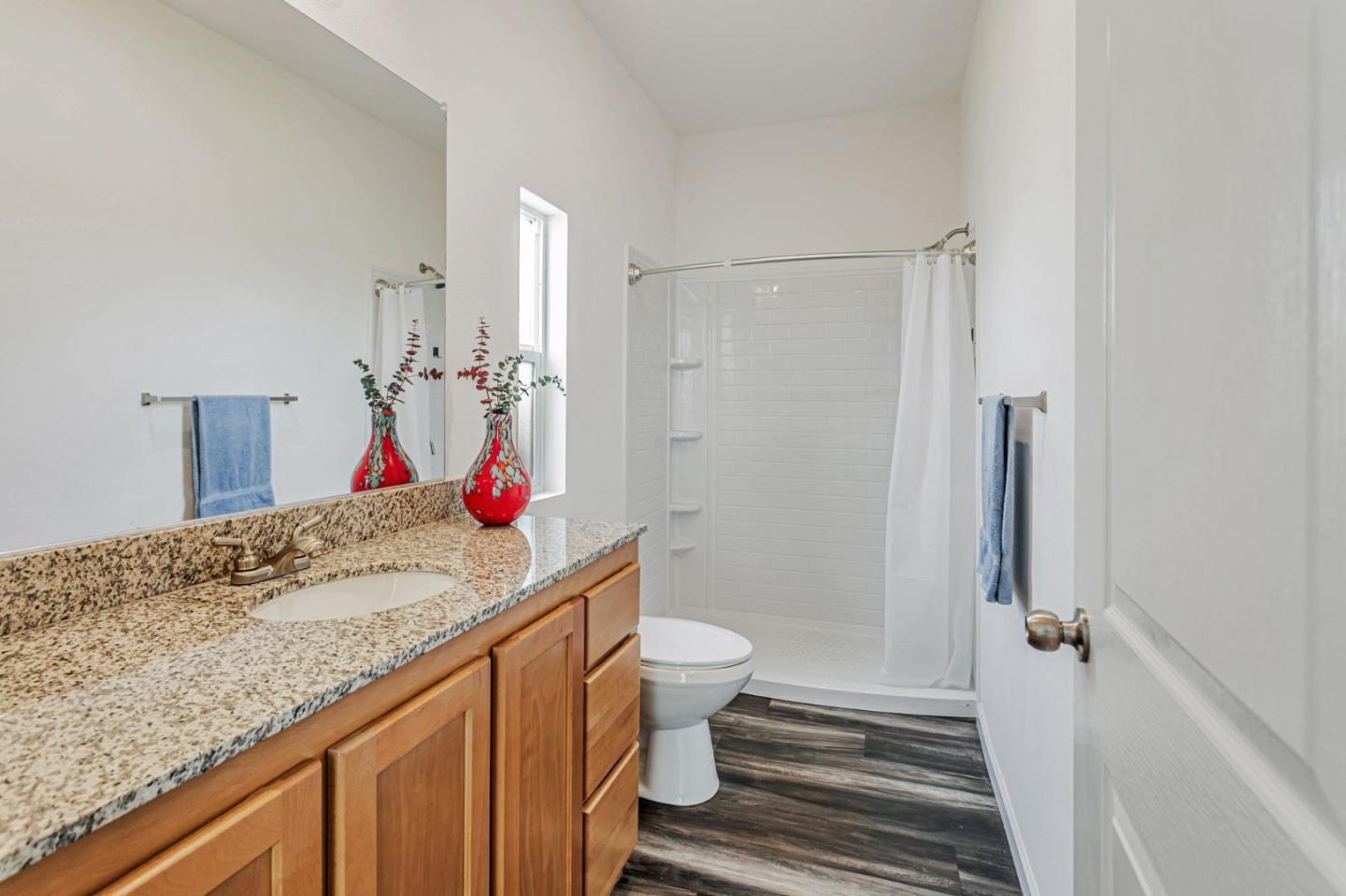 356 Reservation Road, Unit 68 Marina, CA 93933 - Photo 22 of 32 a bathroom with a sink toilet vanity and shower
