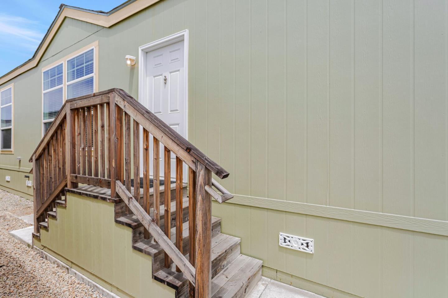 356 Reservation Road, Unit 68 Marina, CA 93933 - Photo 4 of 32 a view of staircase with wooden floor and white walls