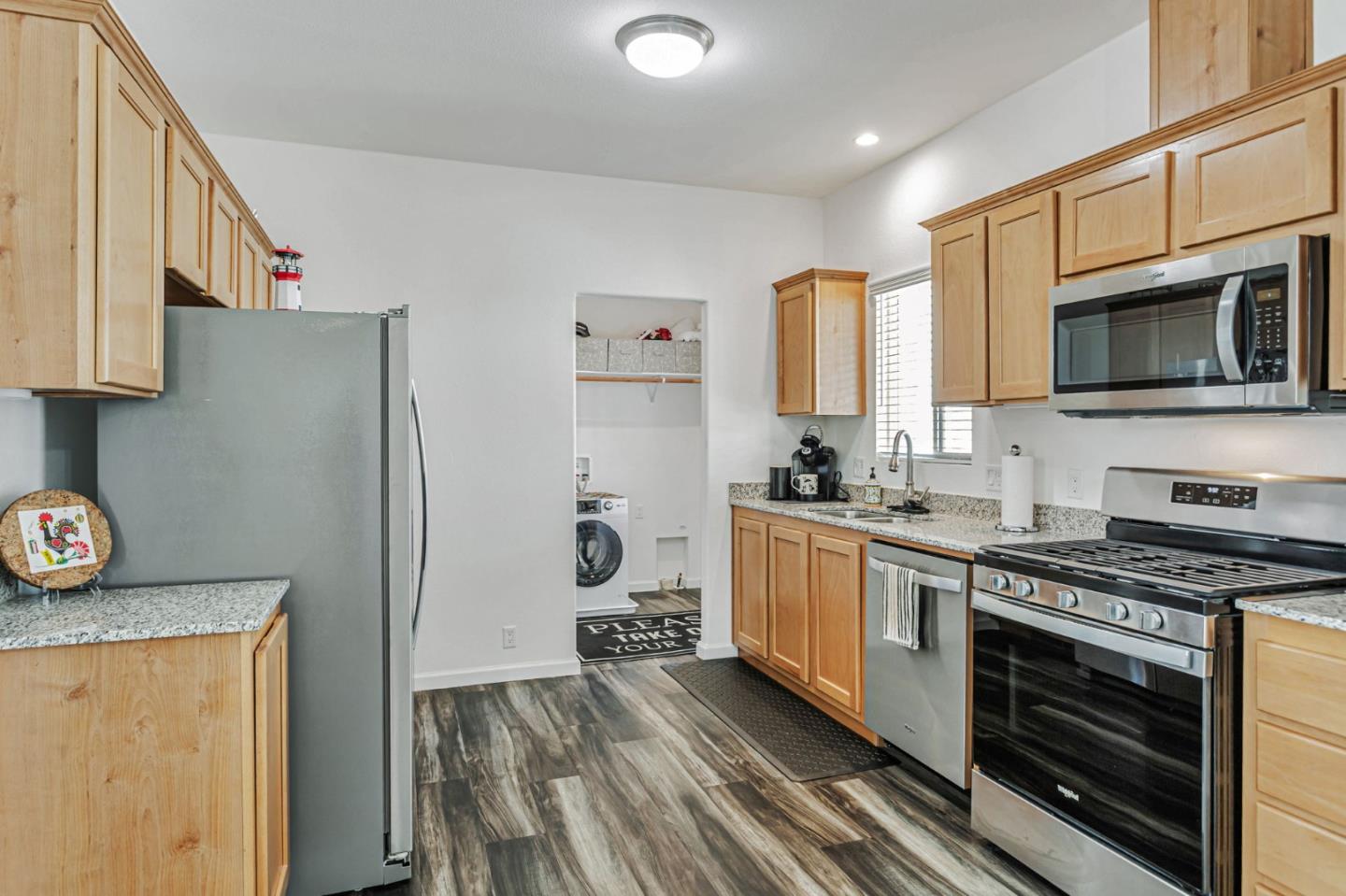 356 Reservation Road, Unit 68 Marina, CA 93933 - Photo 8 of 32 a kitchen with stainless steel appliances a stove microwave and sink