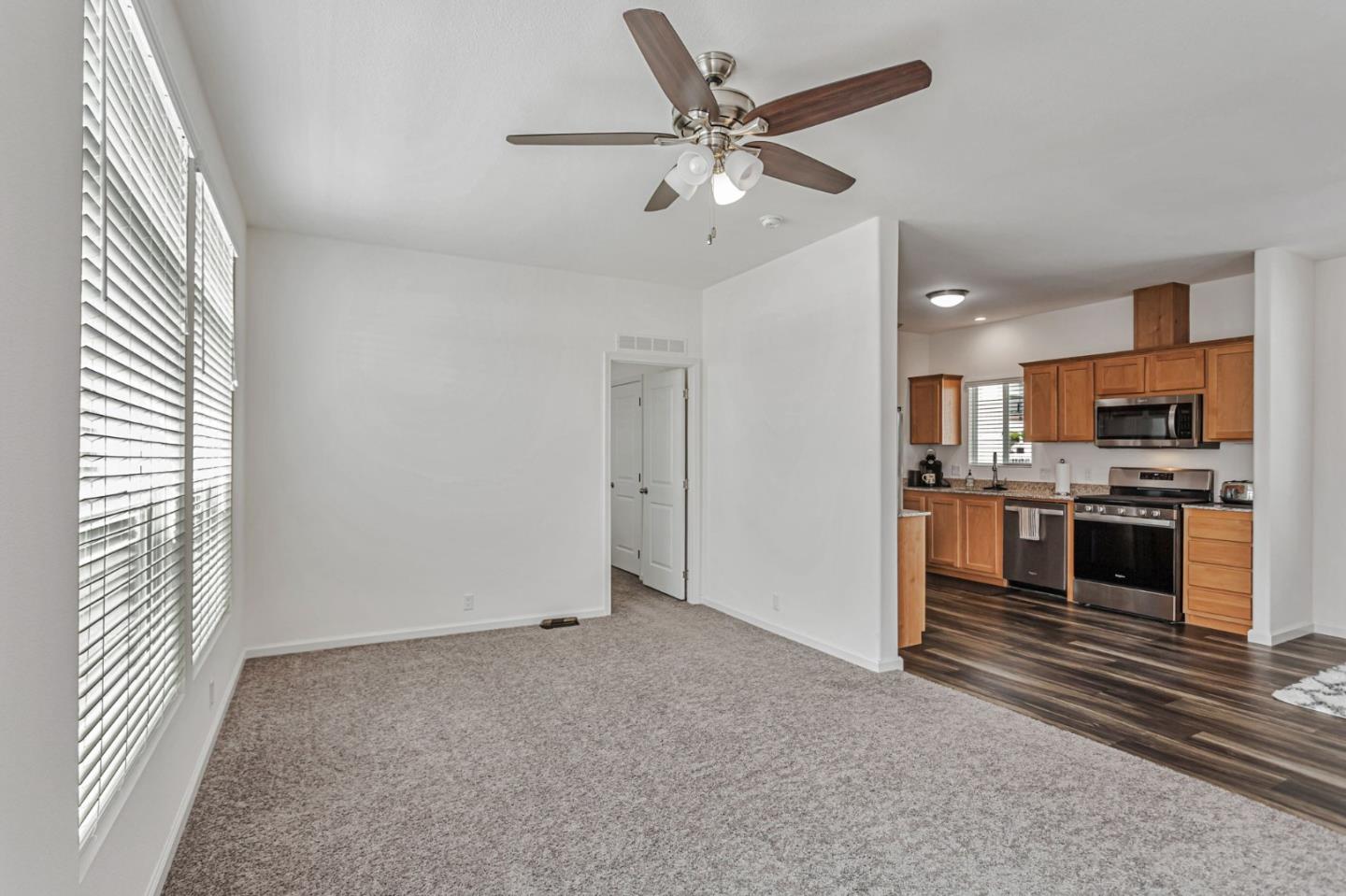 356 Reservation Road, Unit 68 Marina, CA 93933 - Photo 9 of 32 a view of a kitchen with a sink dishwasher and a refrigerator