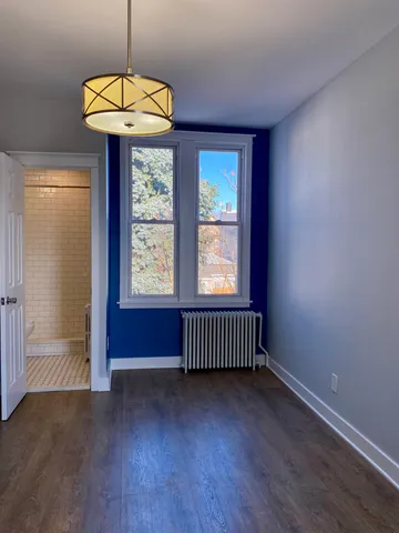 a view of entryway with wooden floor