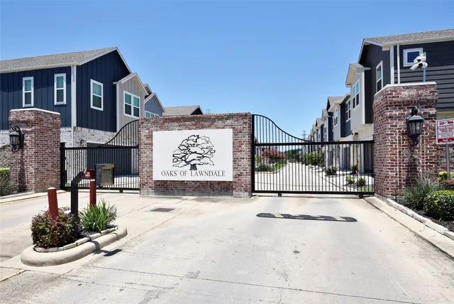 a view of entrance gate of building and street