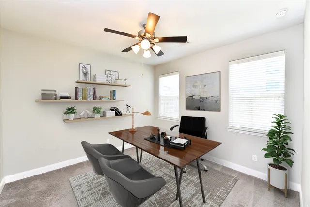 a workspace with furniture and a window