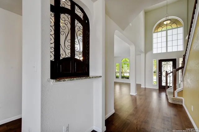 a view of an entryway with wooden floor
