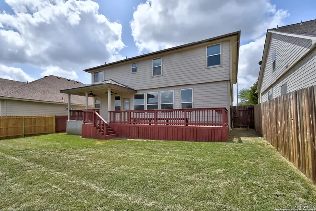 a view of a house with a yard porch and sitting area