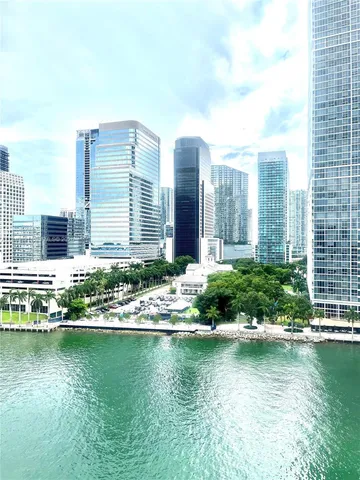 a view of a lake with a large building