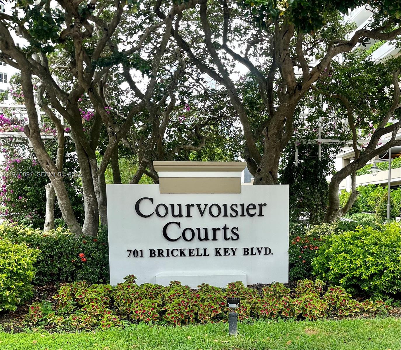 701 Brickell Key Boulevard, Unit 1402 Miami, FL 33131 - Photo 3 of 12 a sign on the side of a building