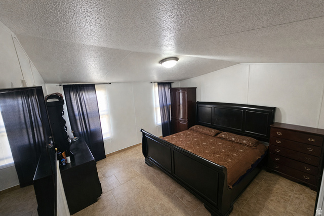 340 West 920 South, Unit 16 Provo, UT 84601 - Photo 8 of 15 Bedroom featuring light tile patterned flooring