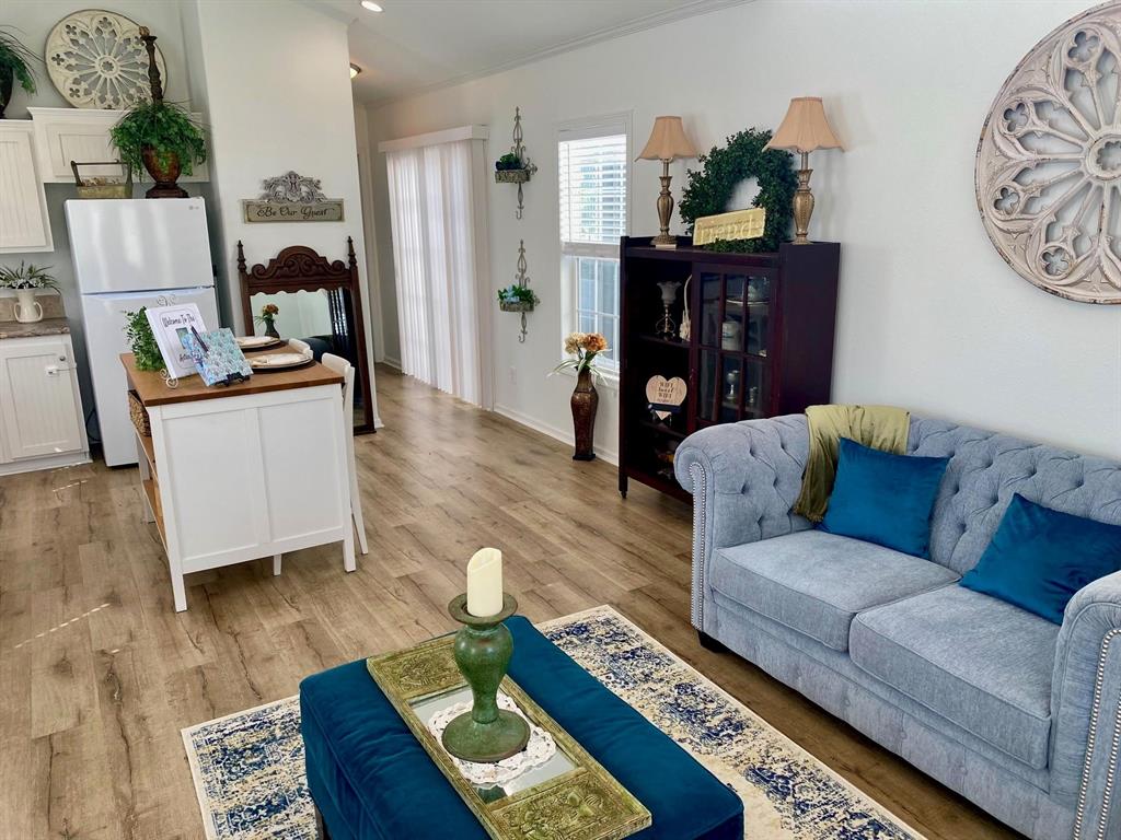 1425 Lone Star Road Celina, TX 75009 - Photo 27 of 40 Cottages A & B - The open-concept layout connects the living area, dining space, and kitchen, creating a bright, comfortable space that lives larger than its footprint. Designed for everyday ease, it's one of the features that helps these tenant-occupied cottages generate dependable rental income.