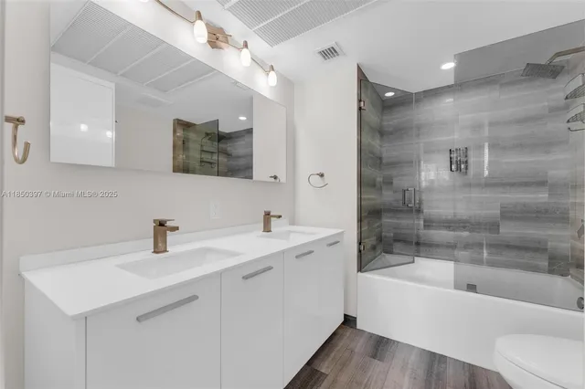 a bathroom with a bathtub and a toilet