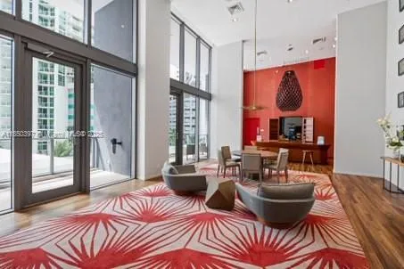 a living room with fireplace furniture and a flat screen tv