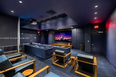 a living room with furniture and large windows