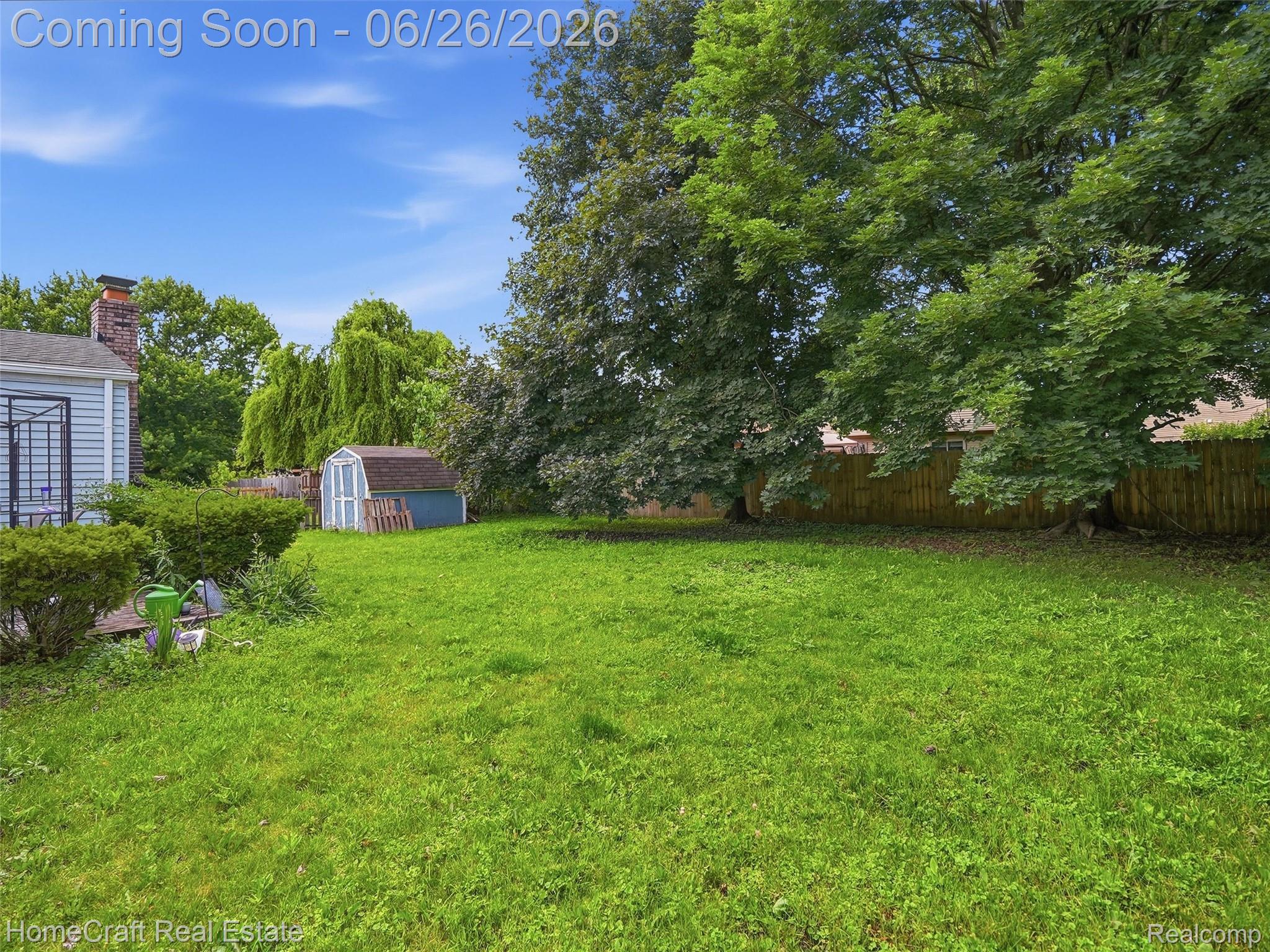 41462 Simcoe Drive Canton, MI 48188 - Photo 8 of 10 Spacious grassy yard with mature trees and a privacy fence