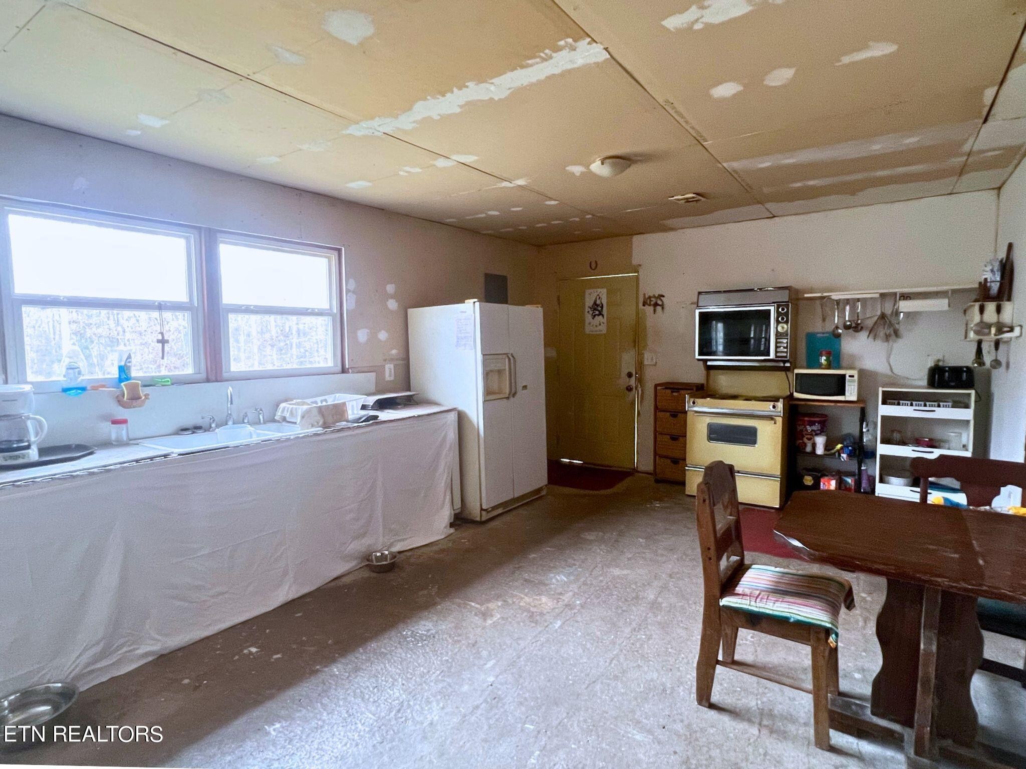 109 Nelson Road Lancing, TN 37770 - Photo 11 of 30 a living room with furniture a flat screen tv and a table