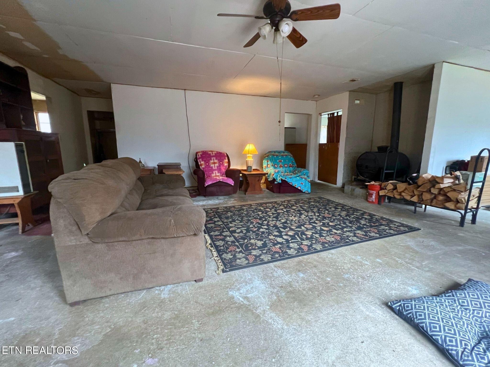 109 Nelson Road Lancing, TN 37770 - Photo 16 of 30 a living room with furniture gym equipment and a rug