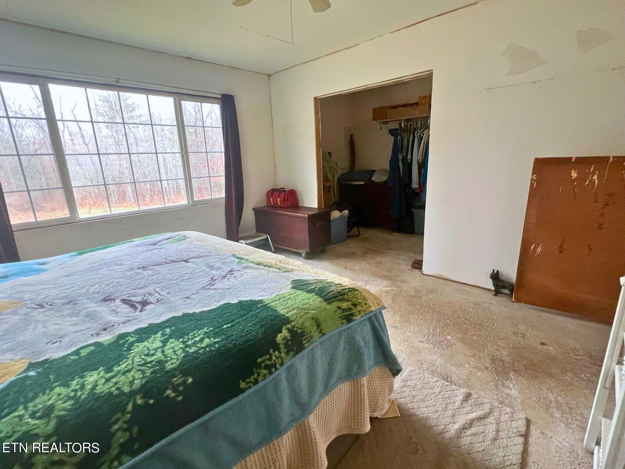 109 Nelson Road Lancing, TN 37770 - Photo 18 of 30 a bedroom with a bed and a large window
