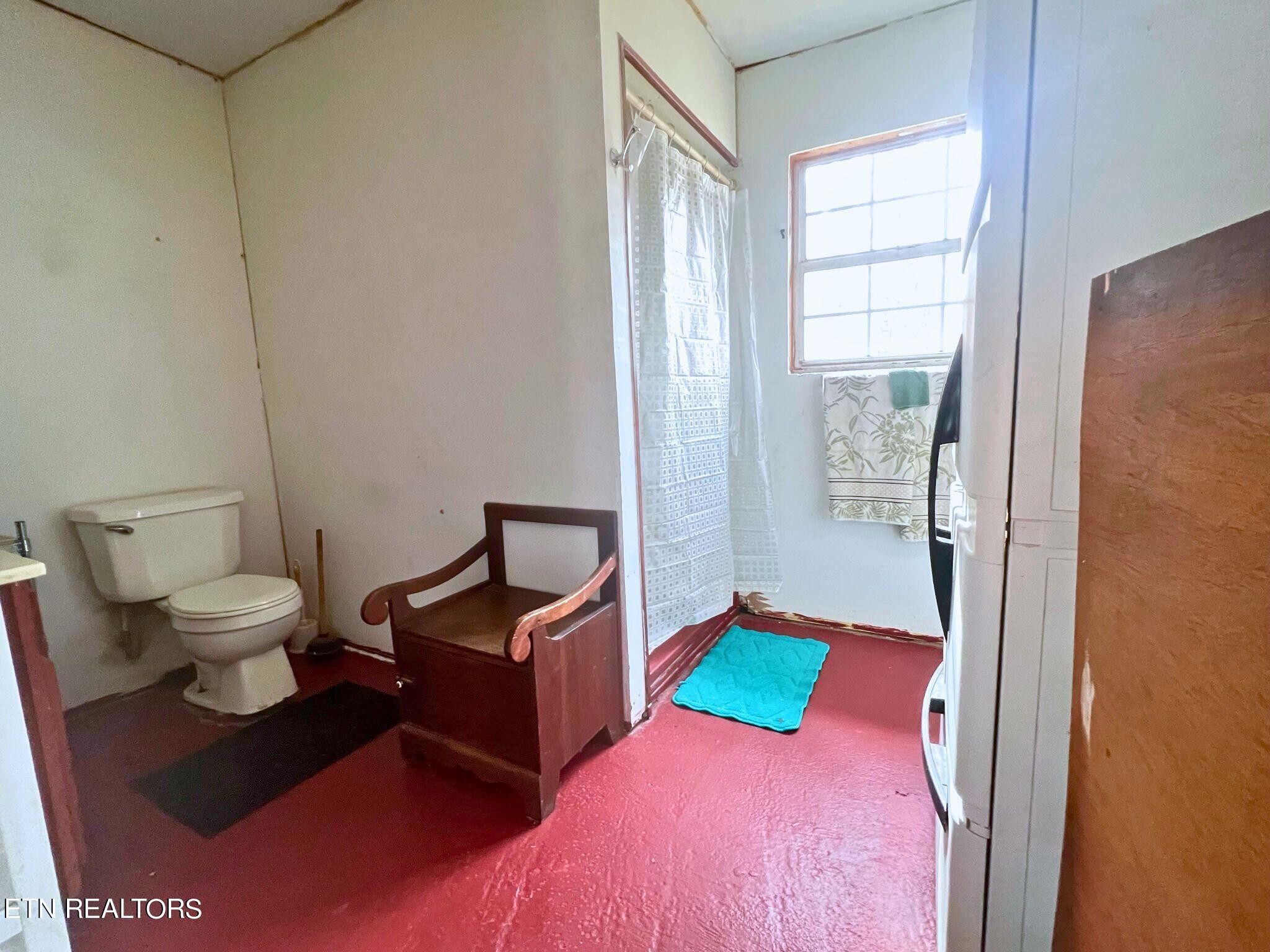 109 Nelson Road Lancing, TN 37770 - Photo 19 of 30 a bedroom with a bed and wooden floor