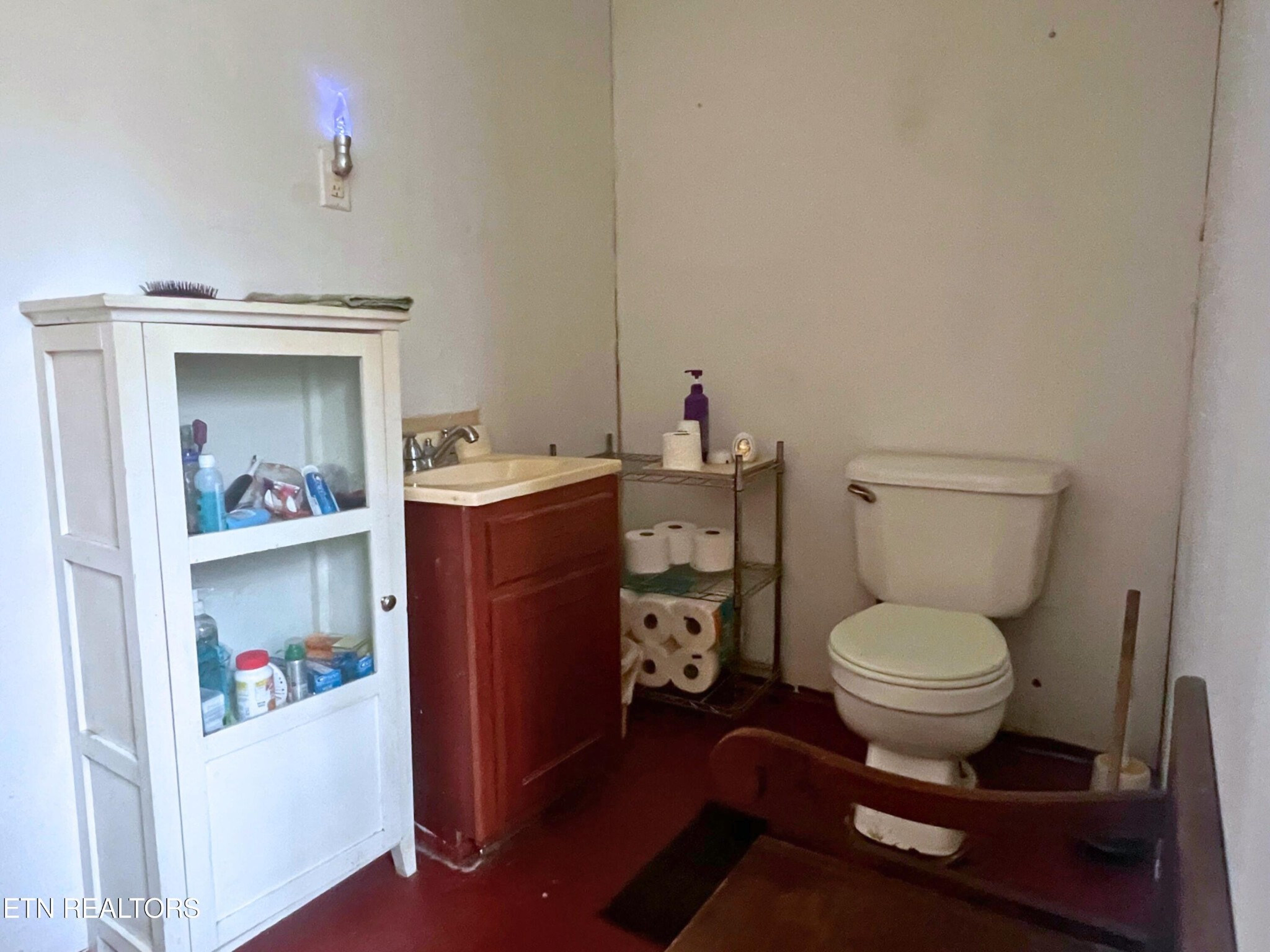 109 Nelson Road Lancing, TN 37770 - Photo 20 of 30 a bathroom with a toilet a sink and a mirror