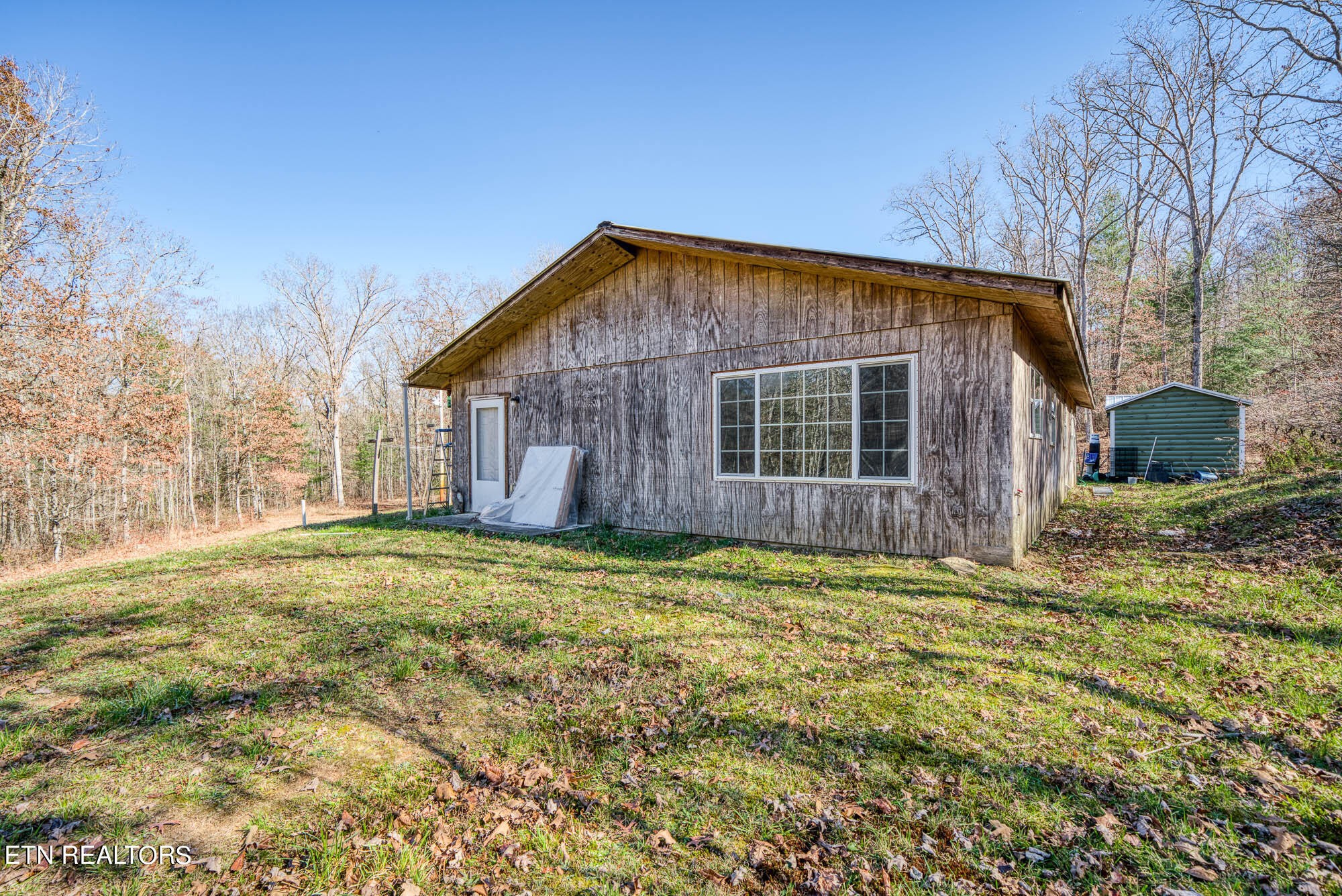 109 Nelson Road Lancing, TN 37770 - Photo 4 of 30 a backyard of a house