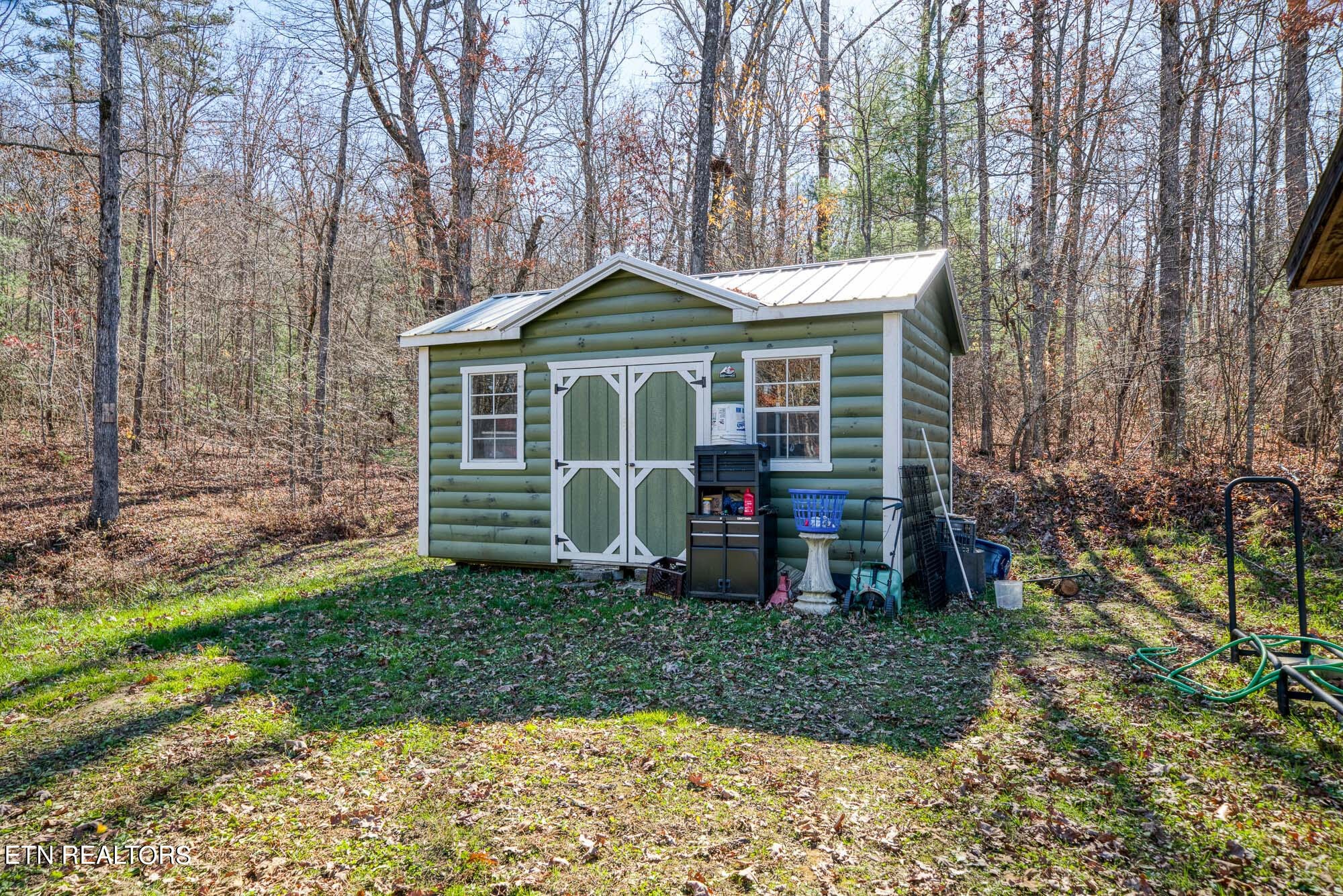109 Nelson Road Lancing, TN 37770 - Photo 7 of 30 a front view of a house with garden