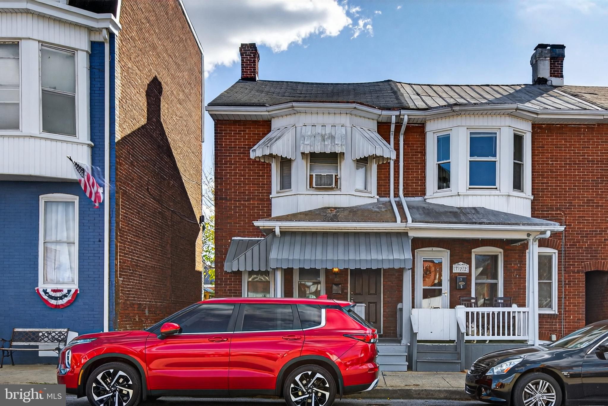 a front view of a house with parking space
