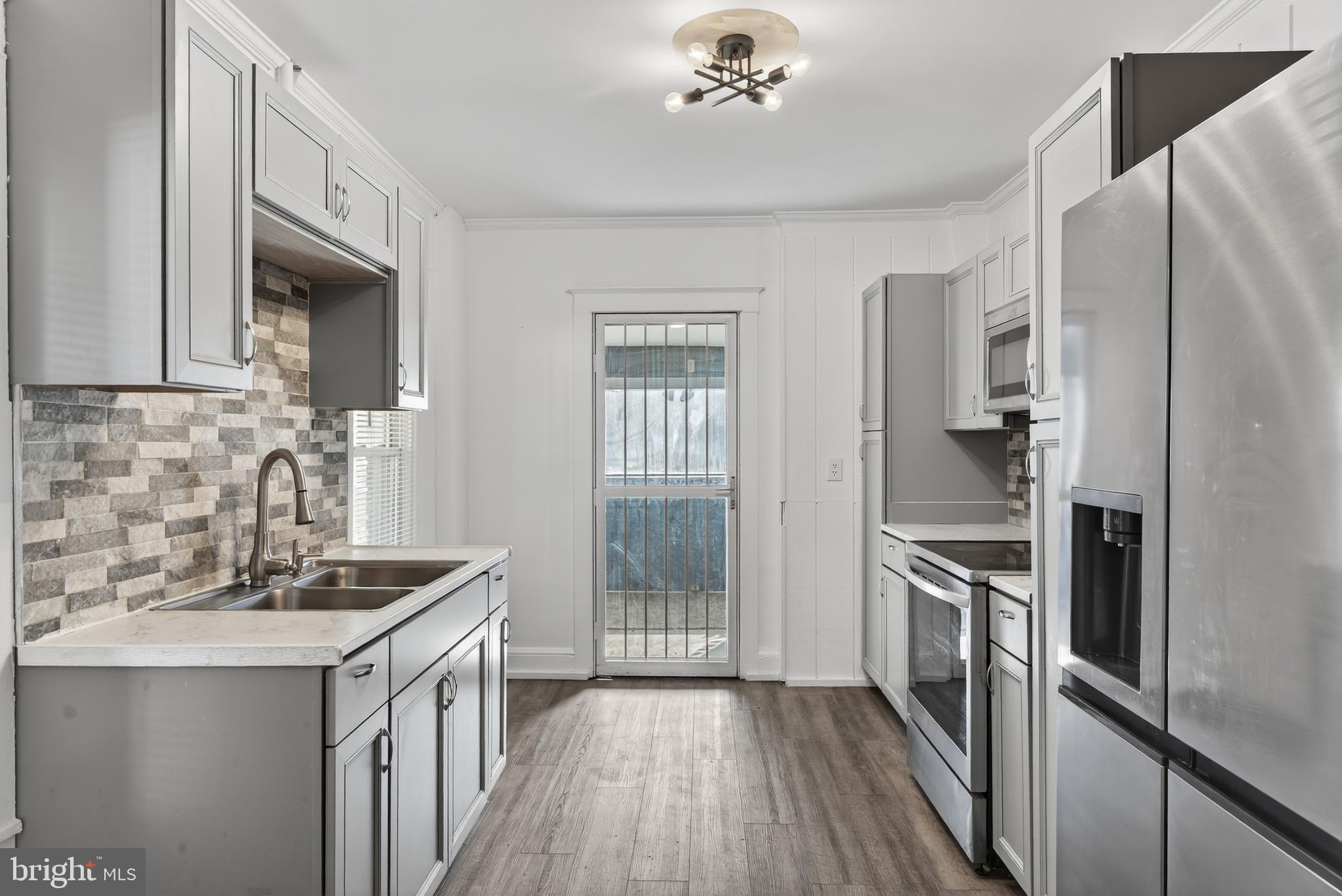 724 York Street York, PA 17403 - Photo 11 of 28 a kitchen with granite countertop a refrigerator stove and sink
