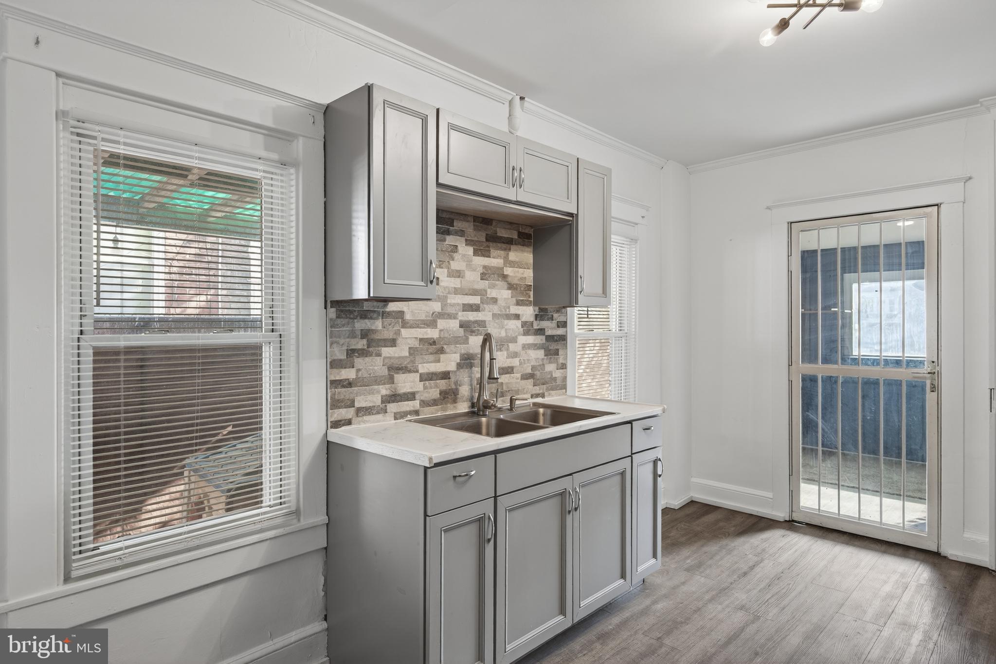 724 York Street York, PA 17403 - Photo 13 of 28 a kitchen with stainless steel appliances granite countertop a sink stove and cabinets