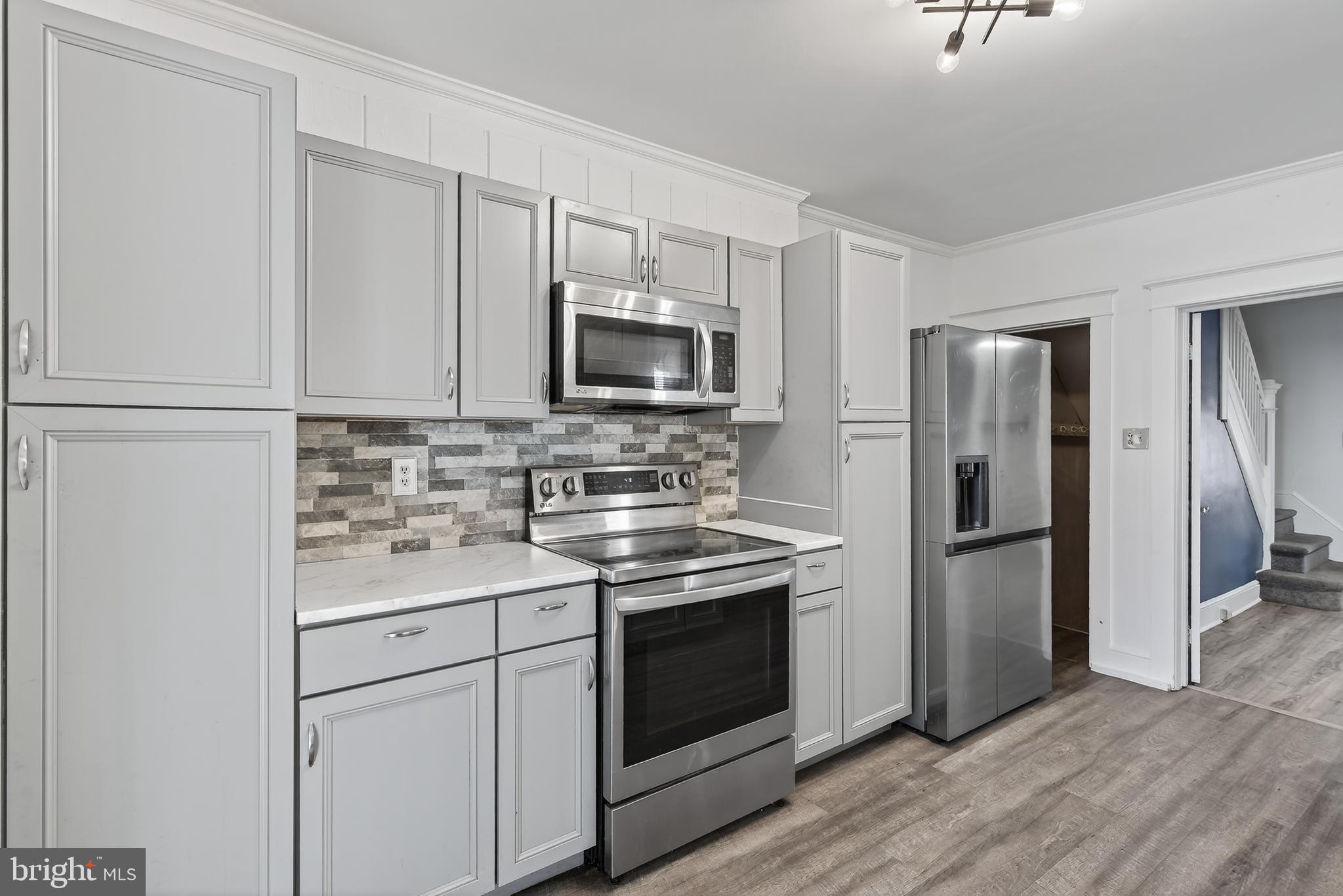 724 York Street York, PA 17403 - Photo 14 of 28 a kitchen with a sink stove and refrigerator