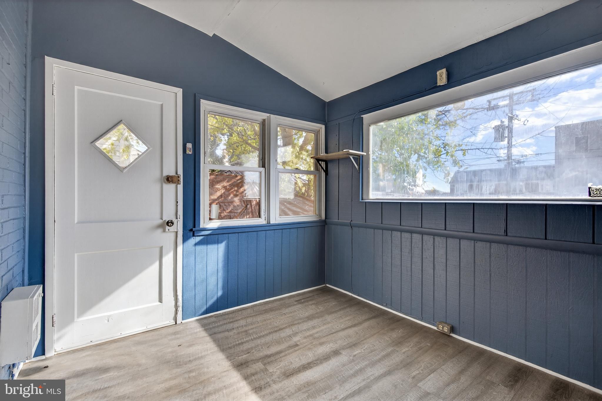 724 York Street York, PA 17403 - Photo 16 of 28 an empty room with wooden floor and windows
