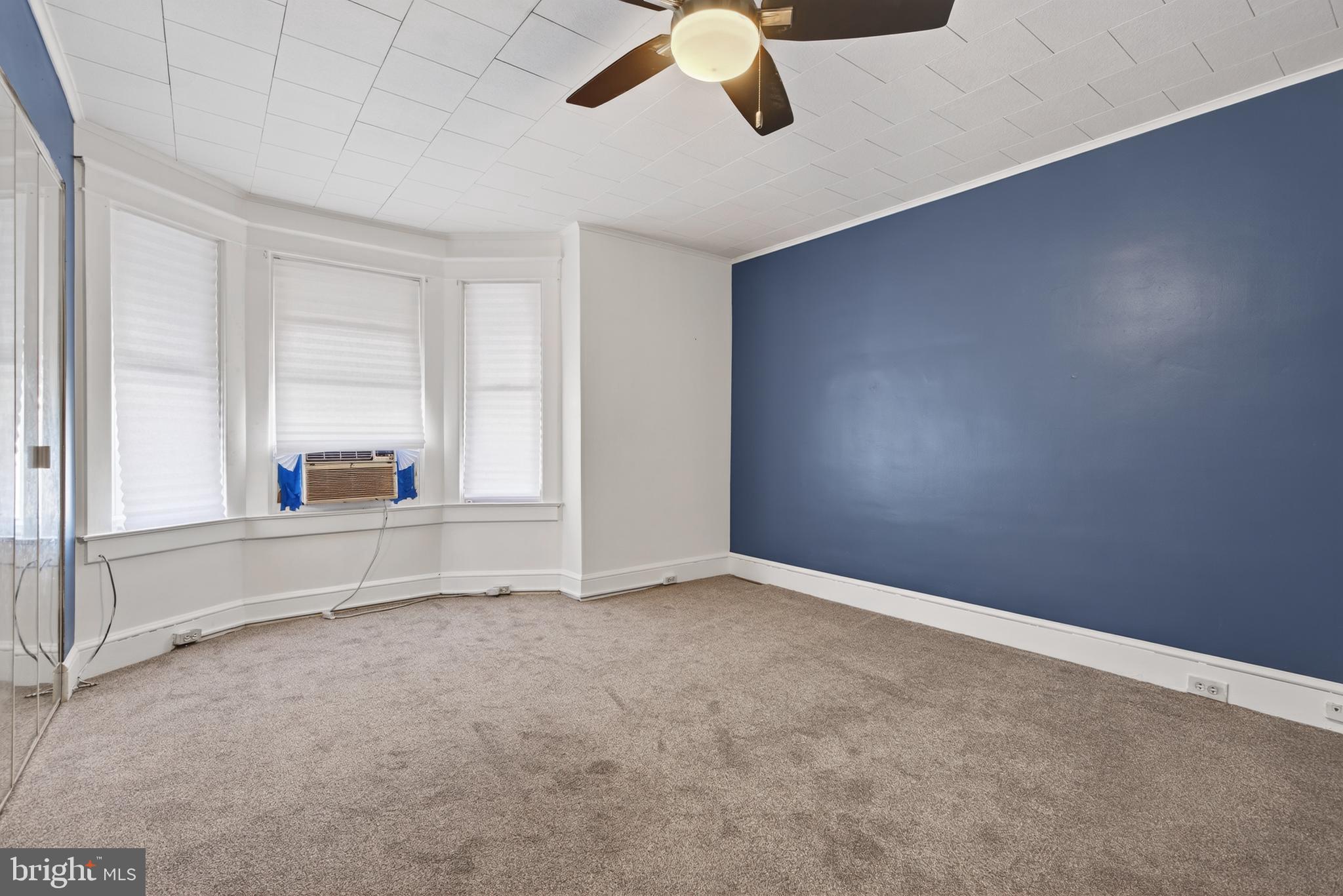 724 York Street York, PA 17403 - Photo 19 of 28 an empty room with a ceiling fan and window