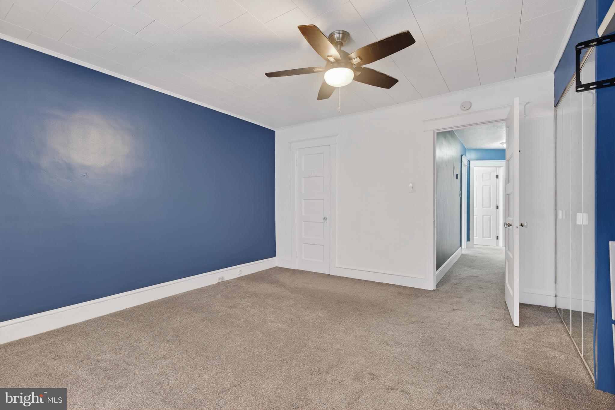 724 York Street York, PA 17403 - Photo 20 of 28 an empty room with a ceiling fan and a window