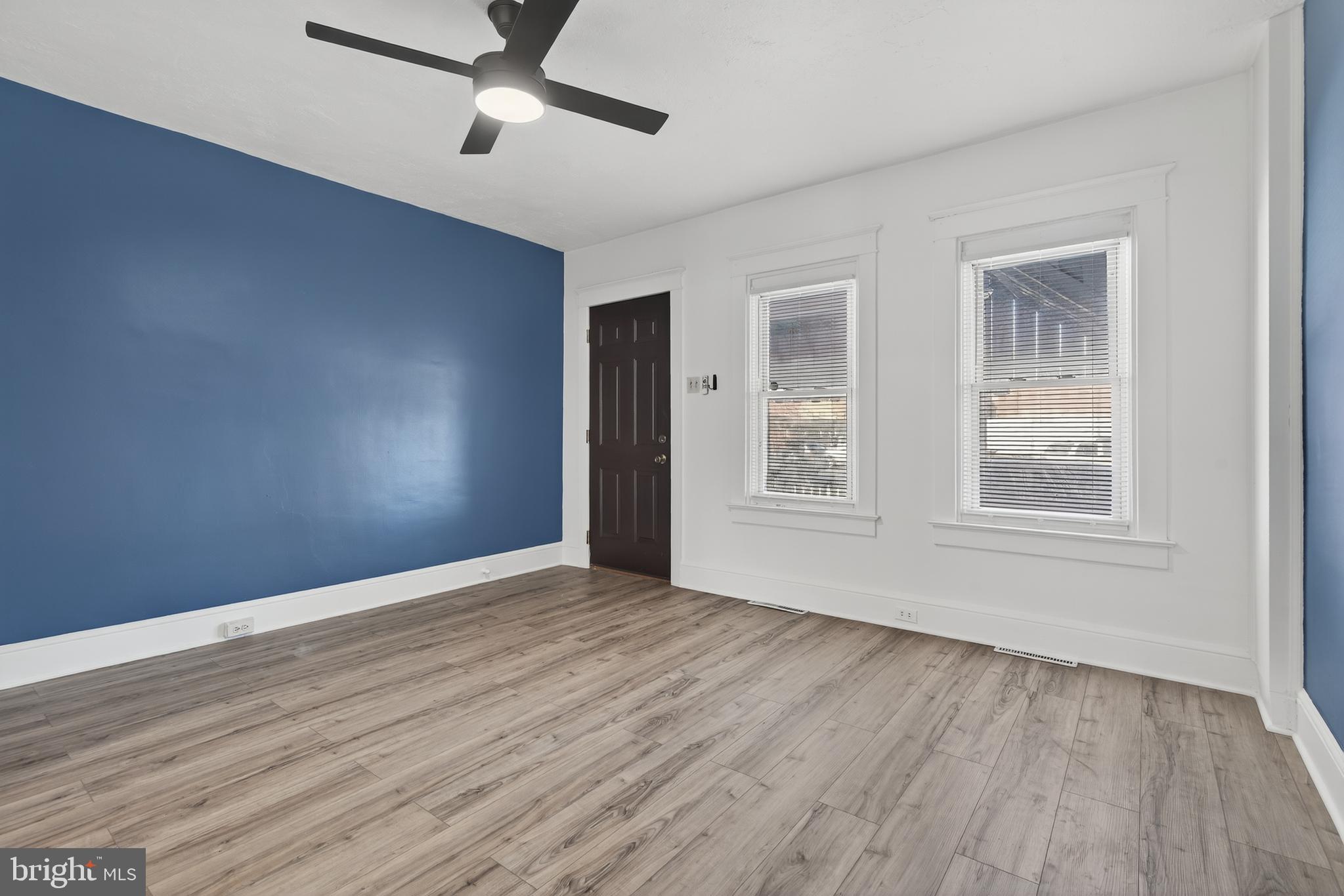 724 York Street York, PA 17403 - Photo 6 of 28 a view of an empty room with wooden floor and a window