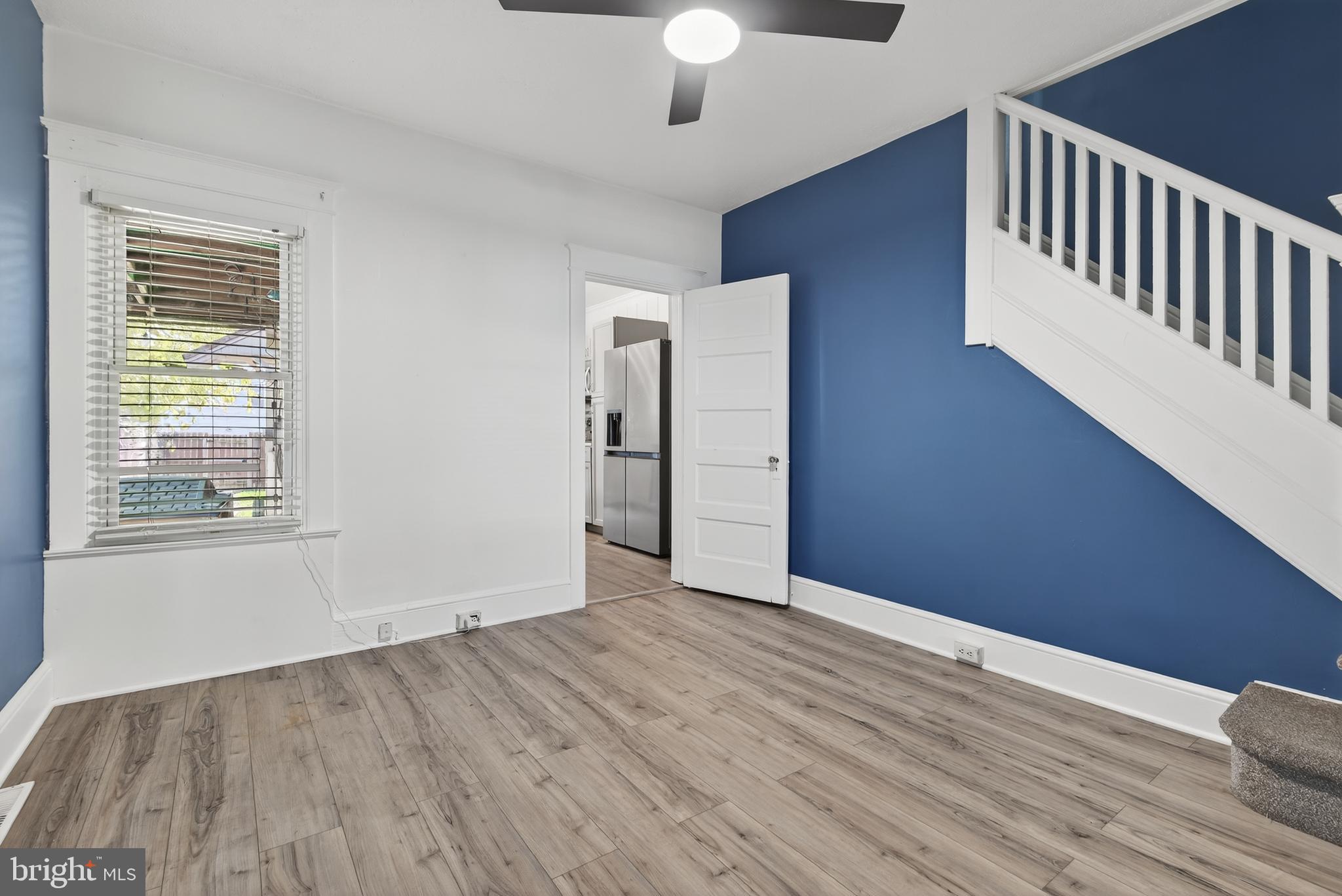 724 York Street York, PA 17403 - Photo 8 of 28 a view of an empty room with wooden floor and a window