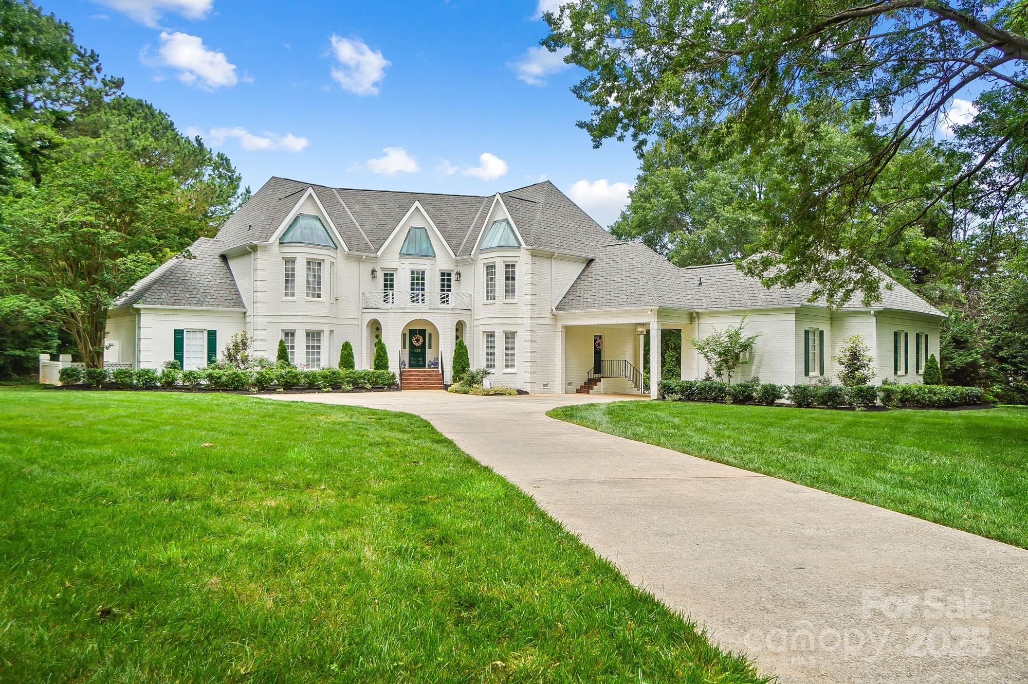 a view of house that has a yard