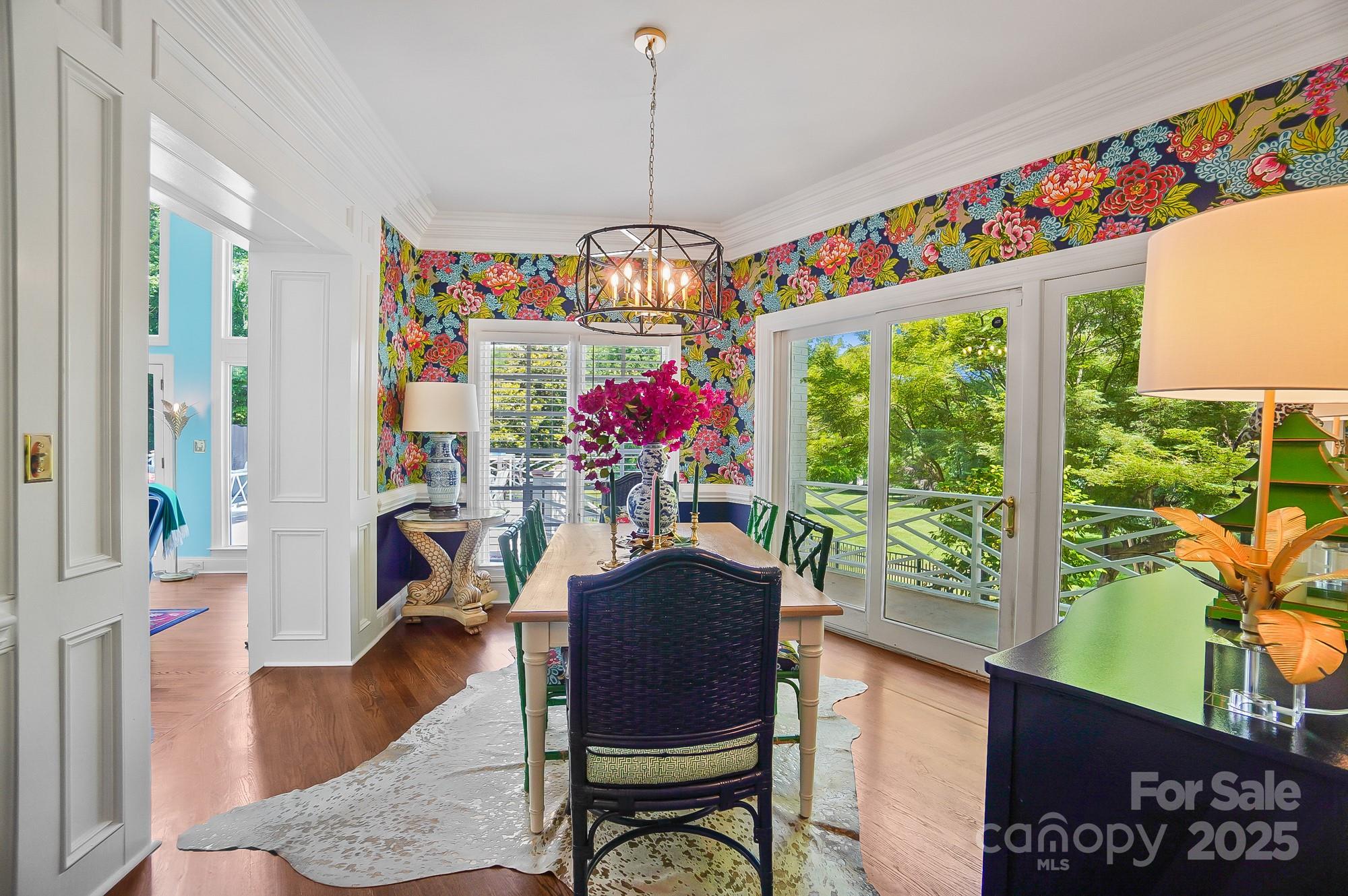 469 Valley Run Road Waxhaw, NC 28173 - Photo 14 of 48 a view of a dining room with furniture a chandelier and wooden floor