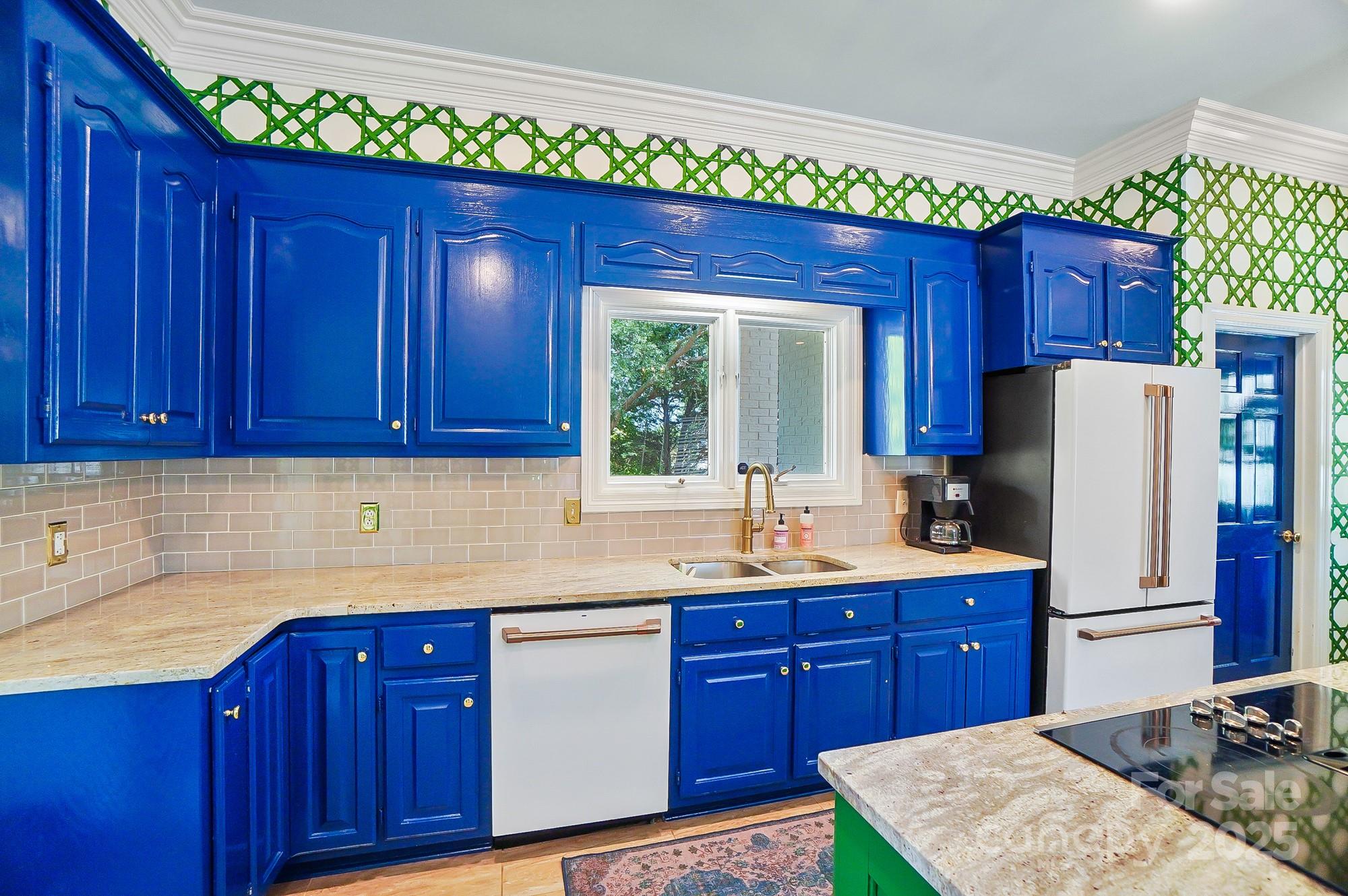 469 Valley Run Road Waxhaw, NC 28173 - Photo 17 of 48 a kitchen with wooden cabinets and sink