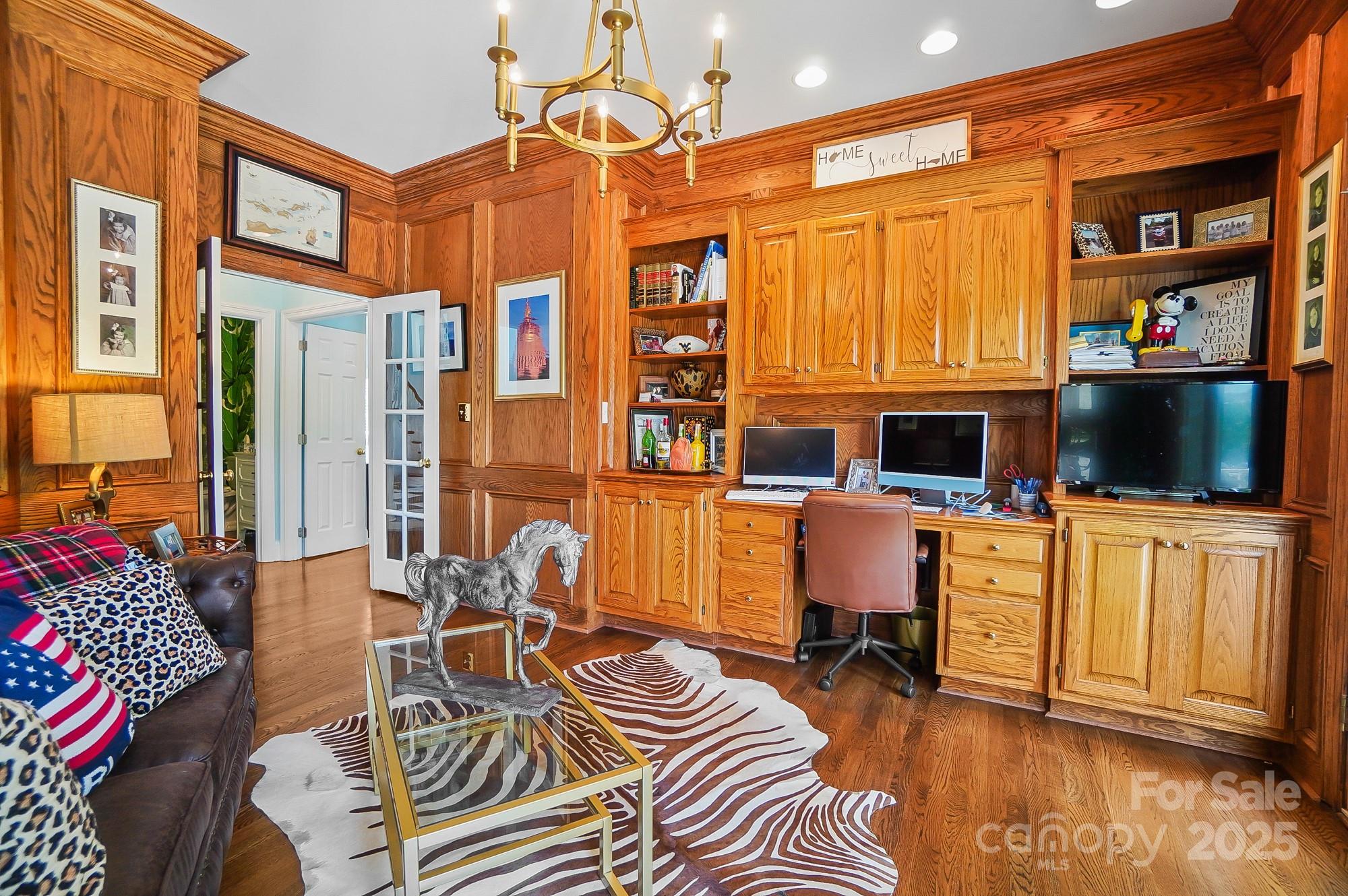 469 Valley Run Road Waxhaw, NC 28173 - Photo 21 of 48 a living room with furniture a piano and a flat screen tv
