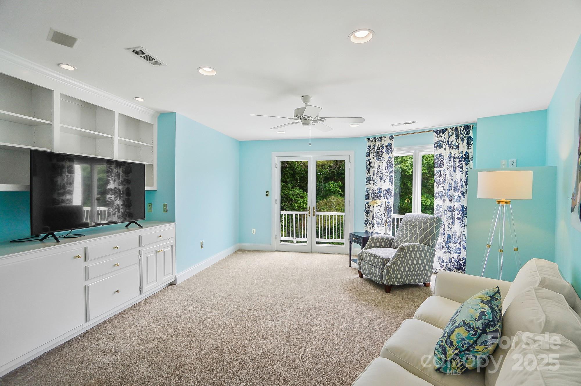 469 Valley Run Road Waxhaw, NC 28173 - Photo 29 of 48 a living room with furniture and a flat screen tv