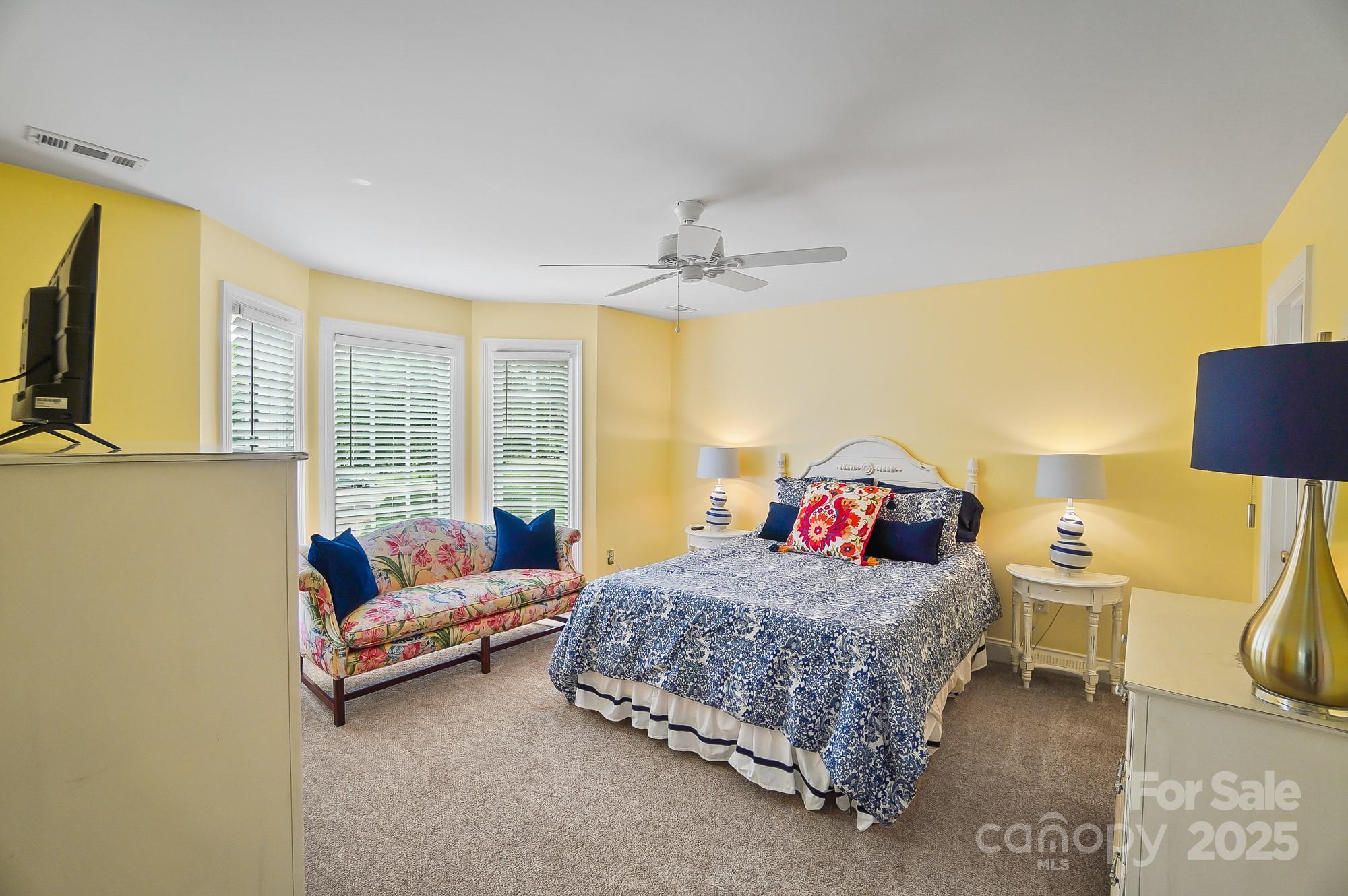 469 Valley Run Road Waxhaw, NC 28173 - Photo 31 of 48 a bedroom with a bed and a couch
