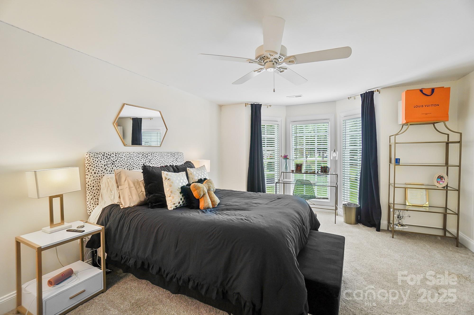 469 Valley Run Road Waxhaw, NC 28173 - Photo 36 of 48 a bedroom with a large bed and a window
