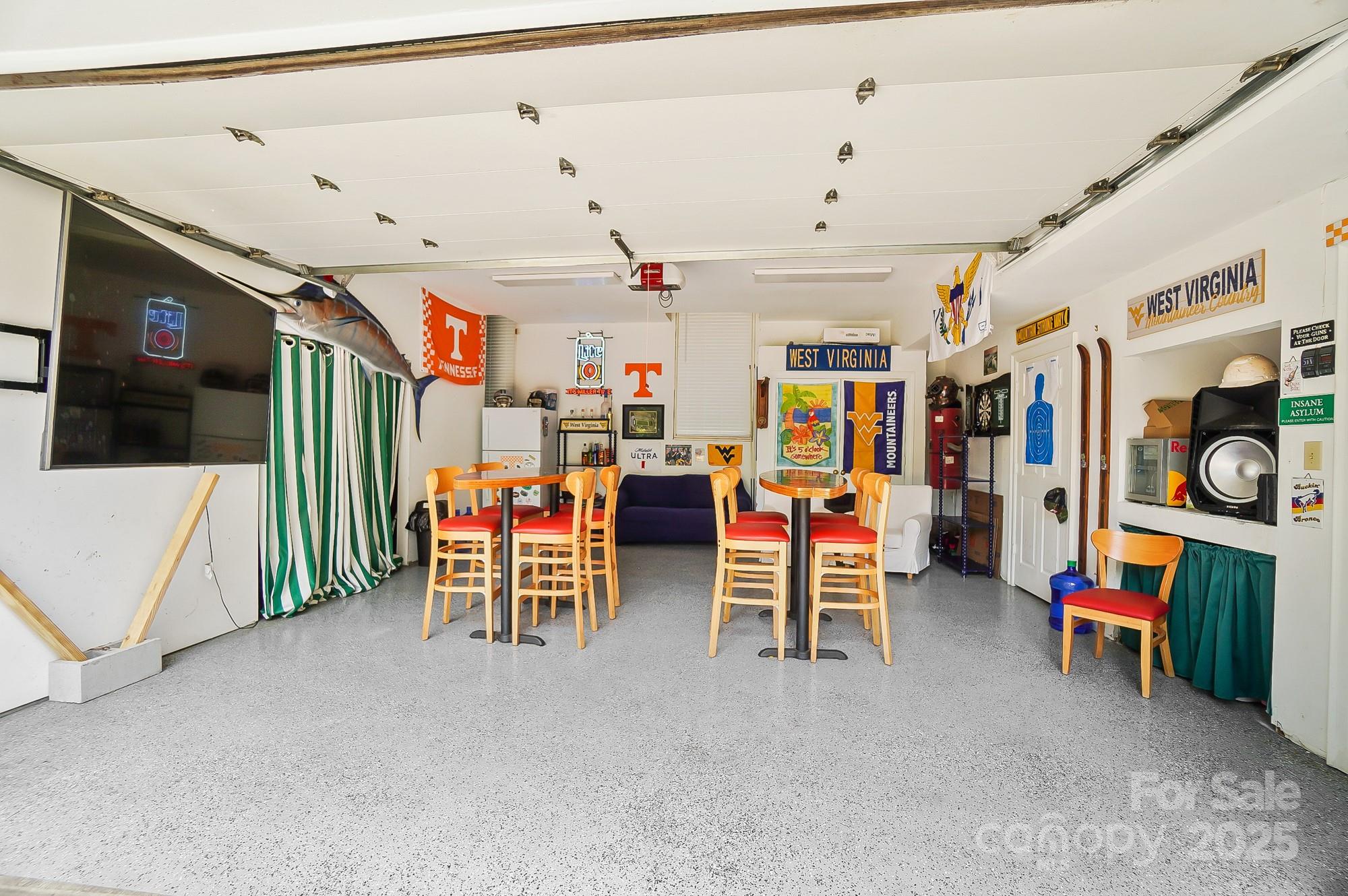 469 Valley Run Road Waxhaw, NC 28173 - Photo 40 of 48 a view of a play room with furniture and a chandelier