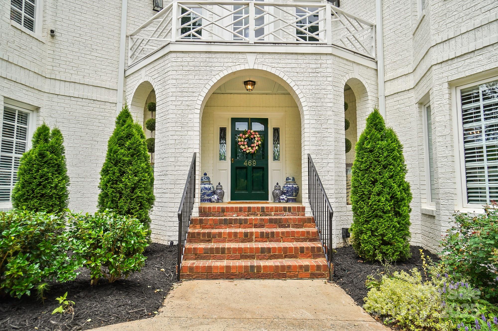 469 Valley Run Road Waxhaw, NC 28173 - Photo 4 of 48 a front view of a house with a garden