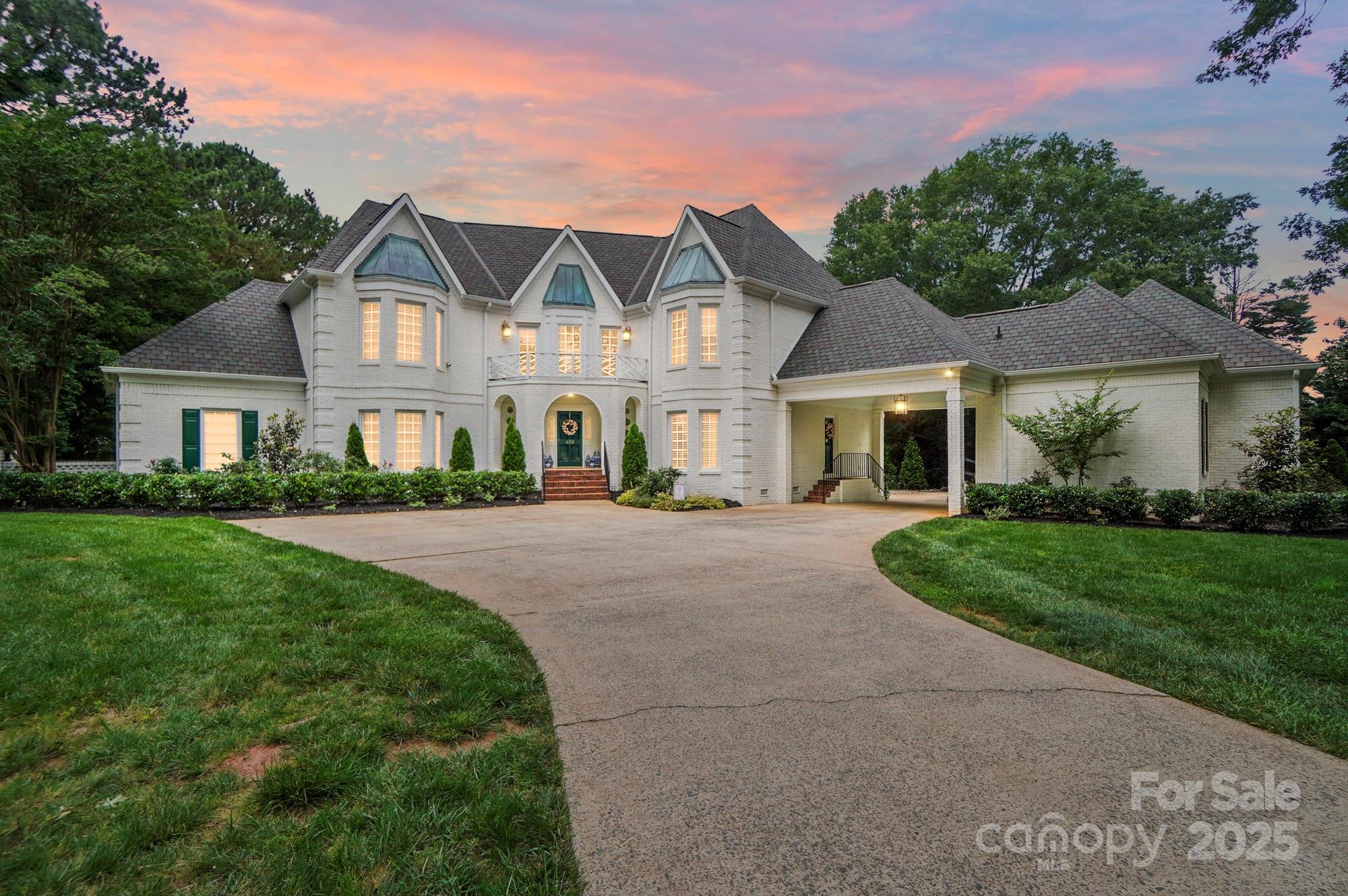 469 Valley Run Road Waxhaw, NC 28173 - Photo 48 of 48 a front view of a house with a garden and yard