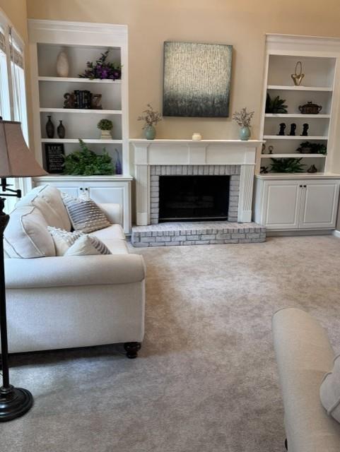 4055 Vista Point Lane Suwanee, GA 30024 - Photo 11 of 42 a living room with furniture and a fireplace