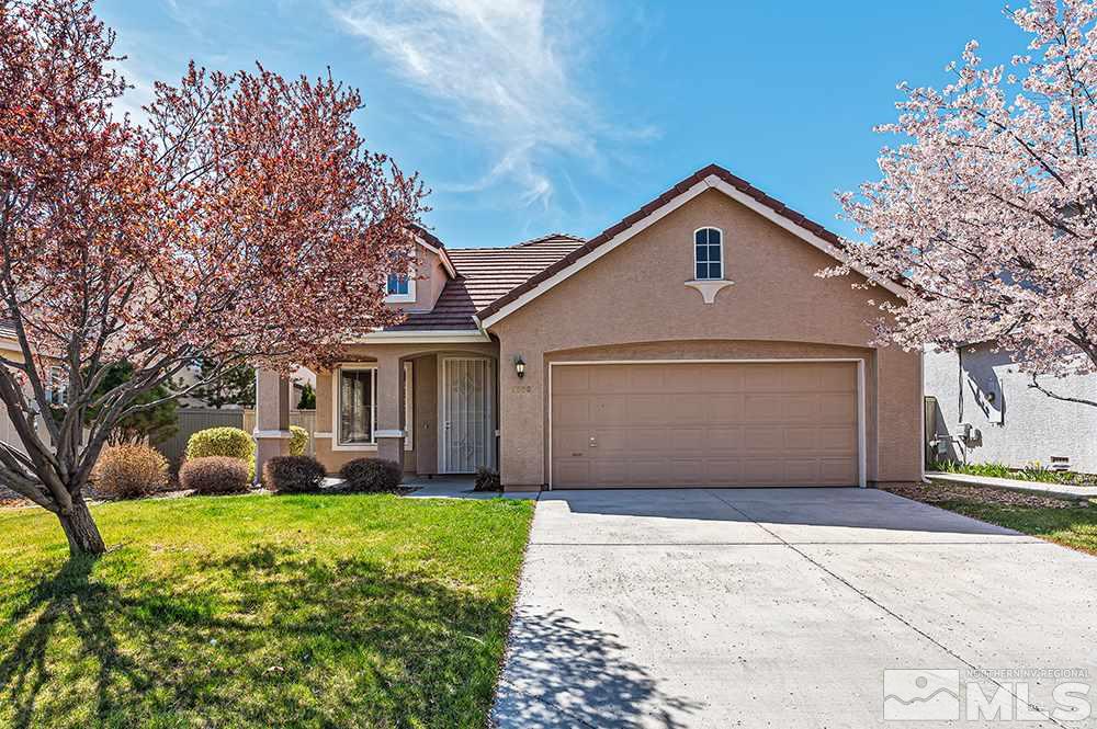 1778 Cavern Drive Reno, NV 89521 - Photo 1 of 15 a front view of a house with a yard and garage