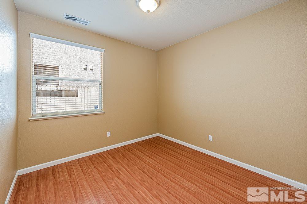 1778 Cavern Drive Reno, NV 89521 - Photo 11 of 15 a view of a room with wooden floor and windows