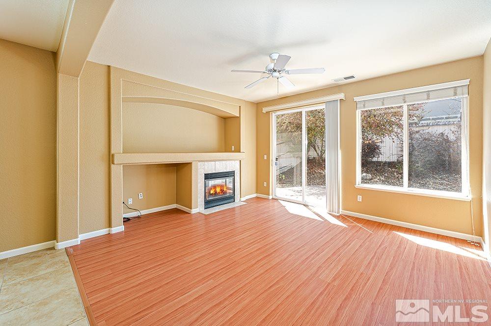 1778 Cavern Drive Reno, NV 89521 - Photo 2 of 15 a view of an empty room with wooden floor and a window