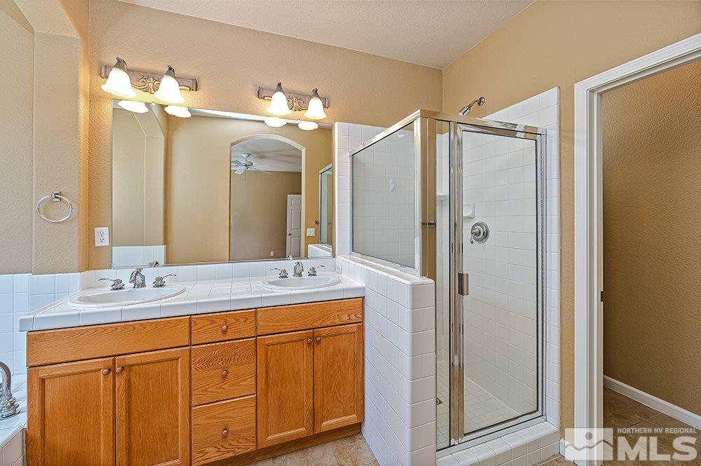 1778 Cavern Drive Reno, NV 89521 - Photo 10 of 15 a bathroom with a double vanity sink mirror and double
