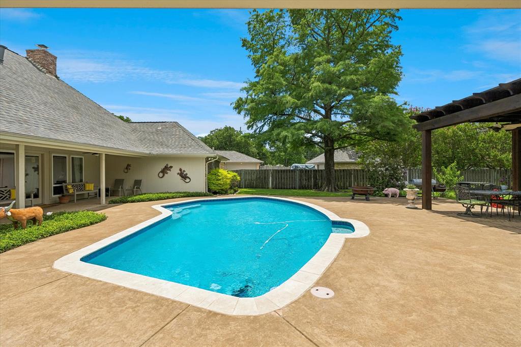 404 Moonlight Lane Keller, TX 76248 - Photo 32 of 40 a view of outdoor space yard swimming pool and patio